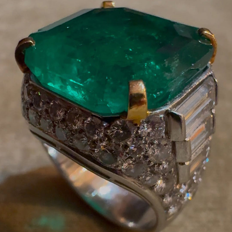 A classic and exquisite ring featuring a dazzling 10.8Ctw emerald and multi-shaped sapphires-JEWELBUYS