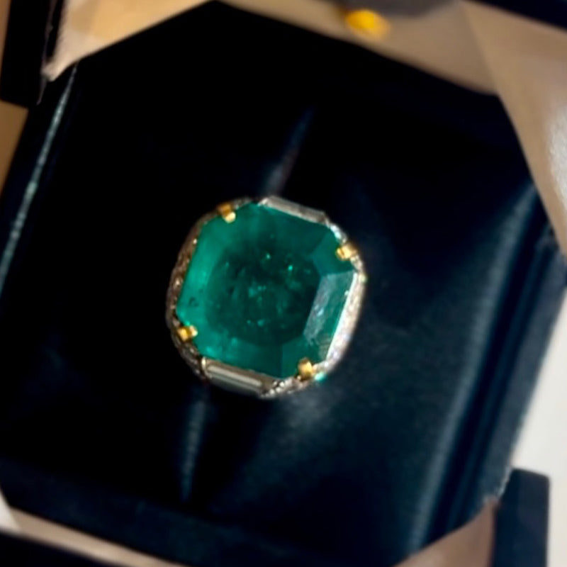 A classic and exquisite ring featuring a dazzling 10.8Ctw emerald and multi-shaped sapphires-JEWELBUYS