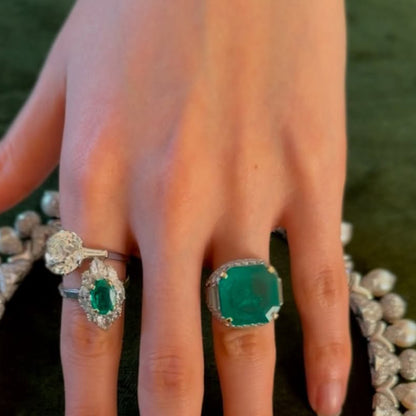 A classic and exquisite ring featuring a dazzling 10.8Ctw emerald and multi-shaped sapphires-JEWELBUYS