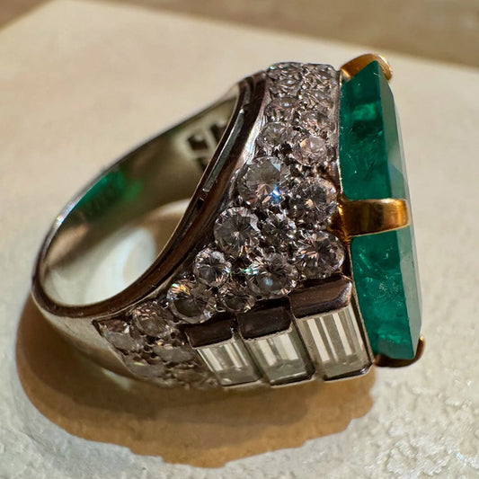 A classic and exquisite ring featuring a dazzling 10.8Ctw emerald and multi-shaped sapphires-JEWELBUYS