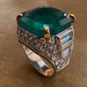 A classic and exquisite ring featuring a dazzling 10.8Ctw emerald and multi-shaped sapphires-JEWELBUYS